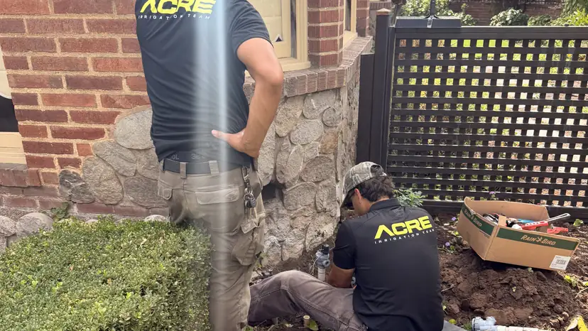 ACRE crew digging out an old valve manifold (ACRE job photo)