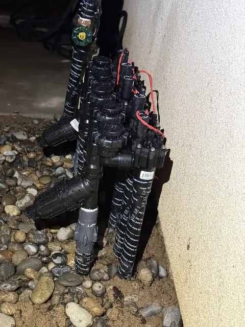 Valve manifold along a wall (ACRE job photo)