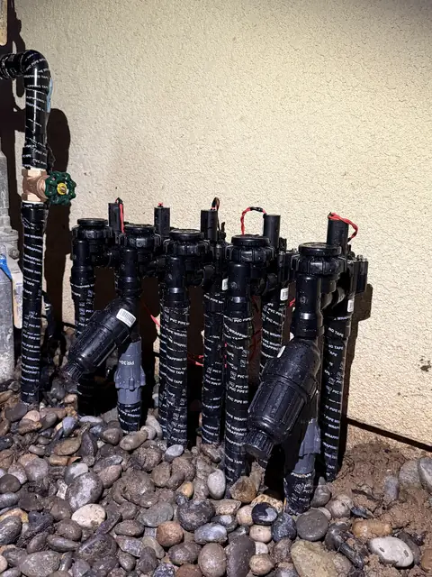 Valve manifold beside a home (ACRE job photo)